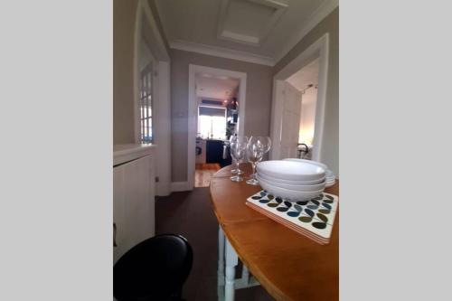 a kitchen with a table with a bowl and glasses on it at Unique 2 Bedroom Apartment in the Ideal Location in Blackpool