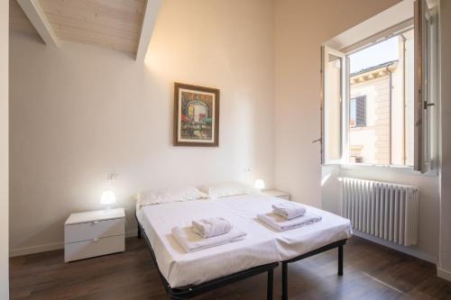 Posteľ alebo postele v izbe v ubytovaní Indipendenza House by Mmega