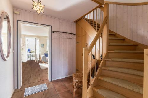 a hallway with a staircase in a house at Ferienhaus Kiebitz in Tönning