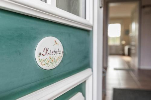 a door with a sign that says butterfly on it at Ferienhaus Kiebitz in Tönning