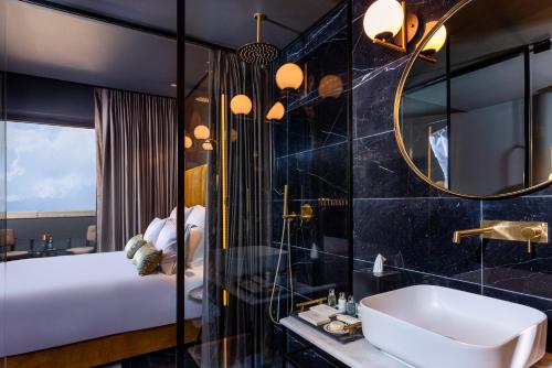 a bathroom with a sink and a mirror at Brown Machne Yehuda, a member of Brown Hotels in Jerusalem