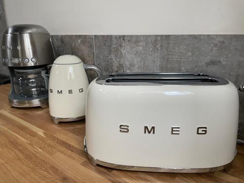 a toaster and a coffee maker on a counter at The old school house in Burwarton