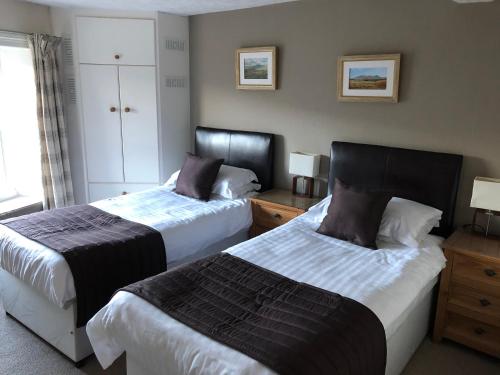 A bed or beds in a room at Herriot's