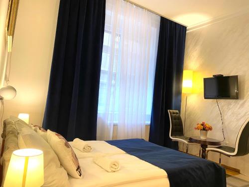 a bedroom with a large bed with a window at Villa Forever in Belgrade