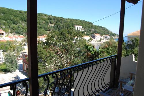 a balcony with a view of a mountain at Pebbles of Kioni in Kiónion