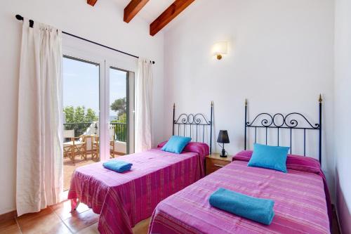 Posteľ alebo postele v izbe v ubytovaní Villa Menorca Juanita by Mauter Villas