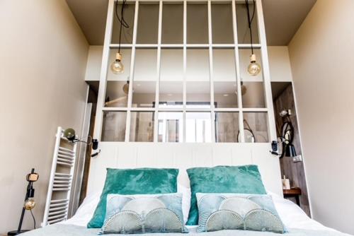 Säng eller sängar i ett rum på Écolodges du Golf du Sauternais