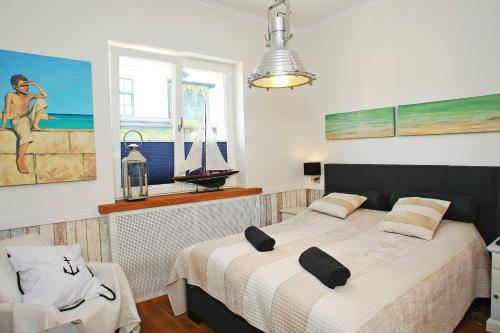 a bedroom with two beds and a window at Grand Apartments - Anchor Apartament Sopot in Sopot