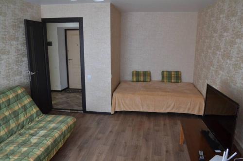 Ліжко або ліжка в номері Apartment Brooklyn in Kamianets-Podilskyi