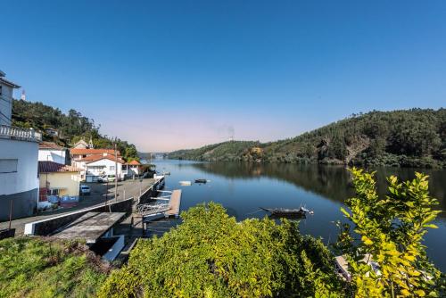 a view of a river with boats on it at Villa Douro in Santa Maria Da Feira