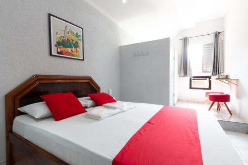 Cama ou camas em um quarto em Hotel Anália Franco