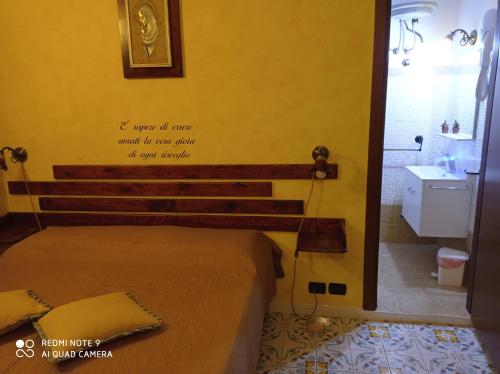 Un pat sau paturi într-o cameră la Casa Vacanze Central Cincotta
