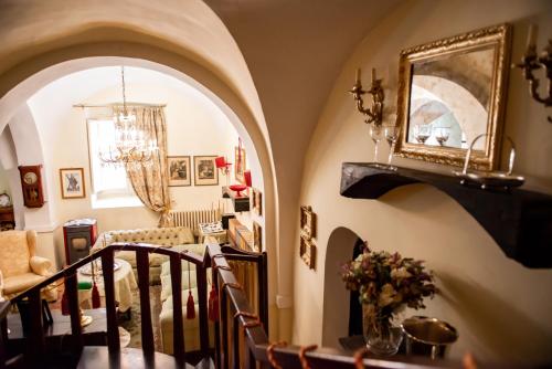 a living room with an archway and a staircase at Casa Isabella B&B in Rocca San Giovanni