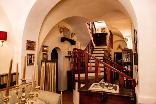 a hallway with a spiral staircase in a house at Casa Isabella B&B in Rocca San Giovanni