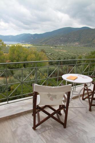 a balcony with a table and chairs and a view at Eleonas hotel in Rovies