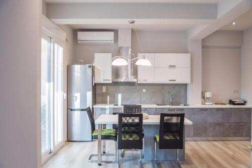 Η κουζίνα ή μικρή κουζίνα στο Athena Apartments