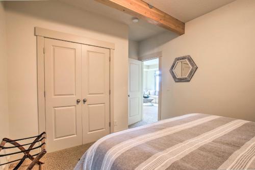 a bedroom with a bed and a wooden ceiling at Luxe Coastal Haven with Bay Views and Hot Tub in Bay City