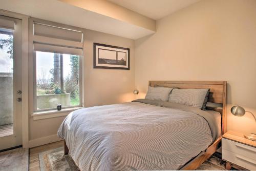 a bedroom with a large bed and a window at Luxe Coastal Haven with Bay Views and Hot Tub in Bay City