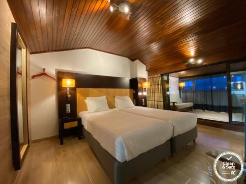 Tempat tidur dalam kamar di Discovery Apartment Carnaxide