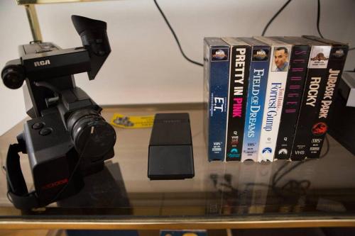 a video camera and some books on a table at Object Hotel 1BR Room 3E in Bisbee