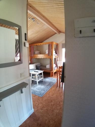 a view of a room with a bed and a mirror at Dalastugan in Mora