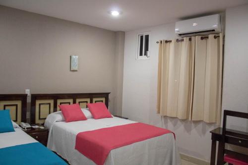 Katil atau katil-katil dalam bilik di HOTEL DE LA PEÑA INN