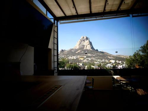 a view of a mountain from inside a building at Hotel Mr Lion and SPA in Bernal