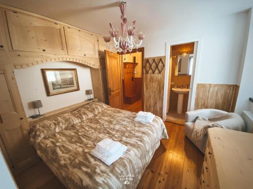 Un pat sau paturi într-o cameră la Una Perla a Cortina