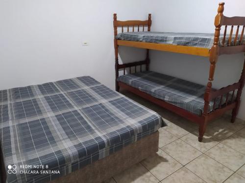 Postel nebo postele na pokoji v ubytování Chácara Santana