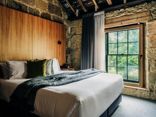 Postel nebo postele na pokoji v ubytování Moss Hotel