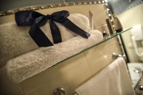 a white towel on a white towel rack at Al Pescatore Hotel & Restaurant in Gallipoli