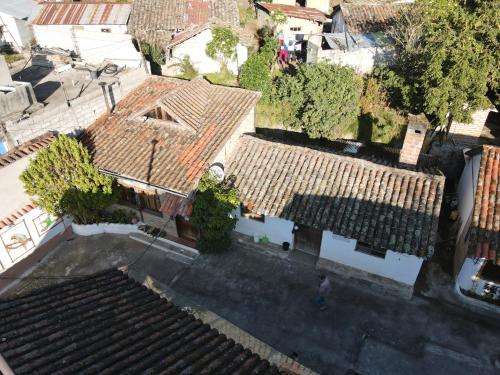 an overhead view of a house with roofs at Hostal Mamá Hilda in Chugchilán