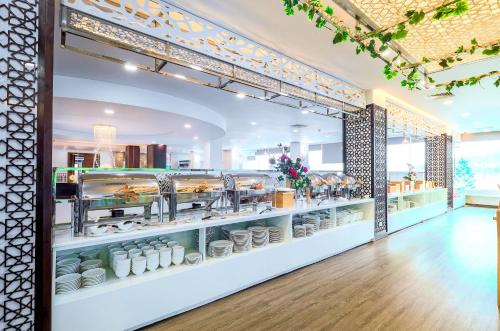 a store with a display case filled with dishes at Vung Tau P&T Hotel in Vung Tau