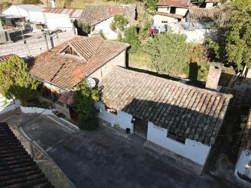 an overhead view of a house with a roof at Hostal Mamá Hilda in Chugchilán