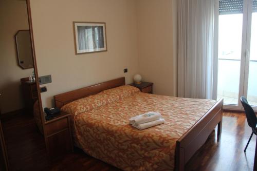 Cama o camas de una habitación en Hotel Il Timone