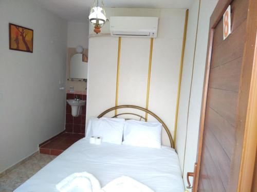 Ένα ή περισσότερα κρεβάτια σε δωμάτιο στο Anz Guest House Pansiyon