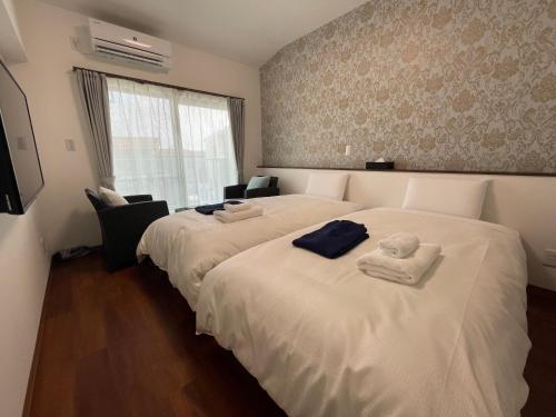 Кровать или кровати в номере HOTEL Ishigakijima 2020