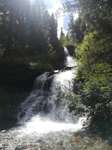 a waterfall in the middle of a river at Haus Martina in Sand in Taufers