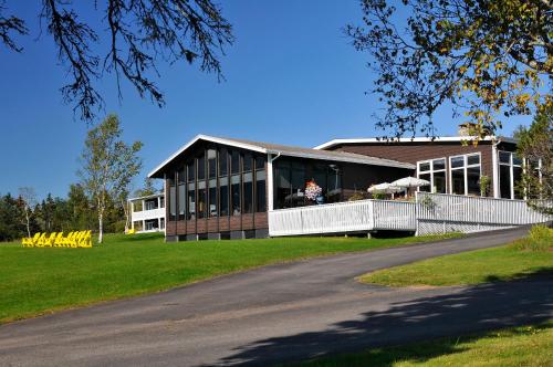 
a large building with a large window on the side of it at Silver Dart Lodge in Baddeck
