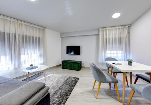 a living room with a couch and a table at Villa Fortuna in Mostar
