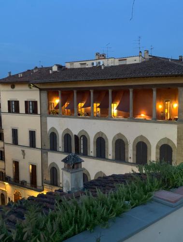 a large white building with a lot of windows at Hotel Palazzo Guadagni in Florence