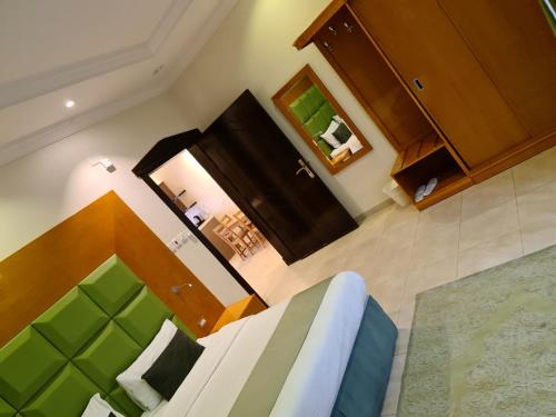 an overhead view of a room with a bed and cabinets at Dshale Chalets in Taif