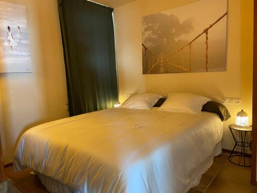 a bedroom with a large bed with a large window at BLANES PORT BAY VIEW in Blanes