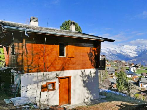 a small house with an orange and white at Chalet Mungg by Interhome in Nendaz