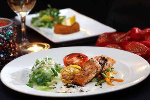 a white plate with food on a table at Hotel St Pierre, Sure Hotel Collection by Best Western in Wakefield