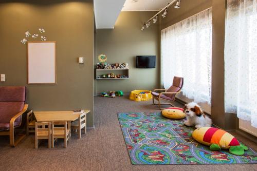 a dog laying on a rug in a room at Georg Ots Spa Hotel in Kuressaare