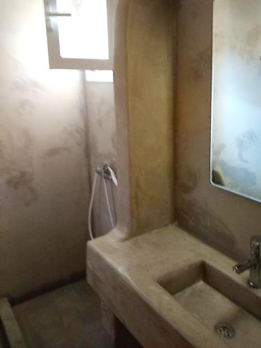 a bathroom with a sink and a mirror at Costareli in Fourni Ikarias