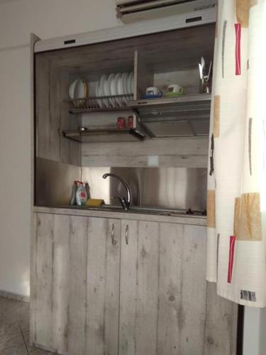 a kitchen with a sink and a sink at Costareli in Fourni Ikarias