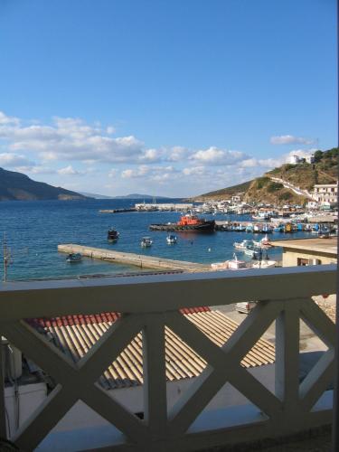 a view of a harbor with boats in the water at Costareli in Fourni Ikarias