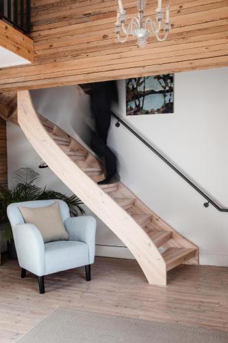 a person walking up the stairs in a house at Upperud 9:9 in Åsensbruk
